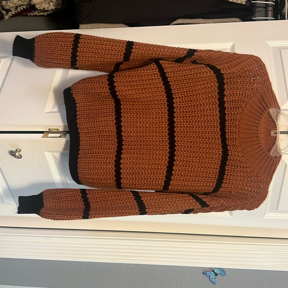 Fall sweater, size M. Dark autumn color with black stripes.